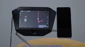 A user interface built with Qt for MCUs for a two-wheeler product, showcasing maps and navigation running natively on an Infineon Traveo 2G microntroller.